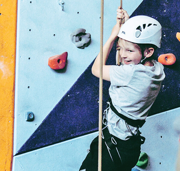 Child on a climbing wall